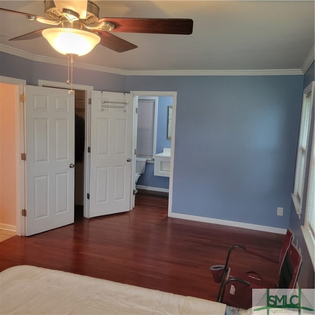 unfurnished bedroom with ceiling fan, dark hardwood / wood-style floors, ensuite bathroom, and ornamental molding