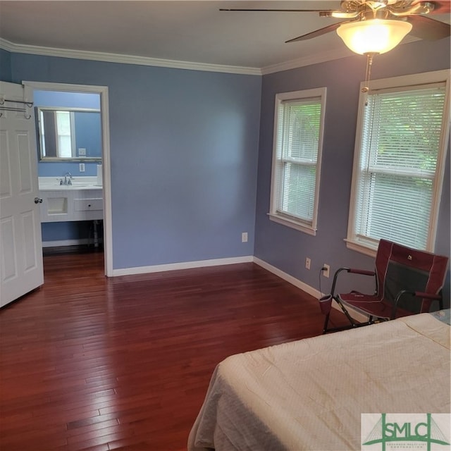 bedroom with crown molding, ceiling fan, dark hardwood / wood-style floors, and sink