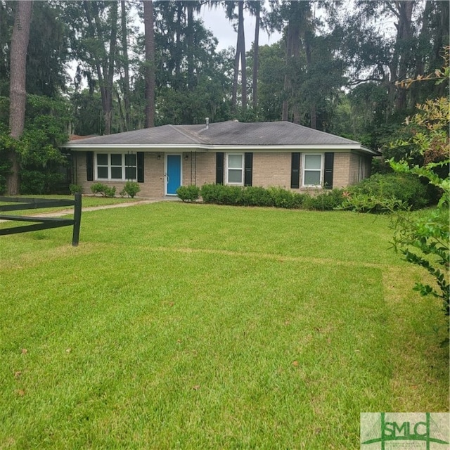 ranch-style home with a front lawn