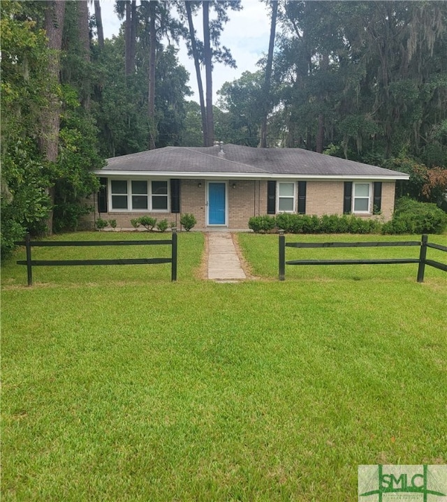 ranch-style home featuring a front yard