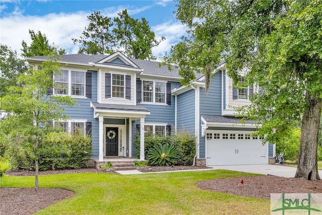 view of front of home with a garage and a front lawn