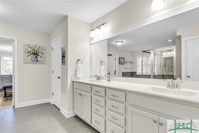 bathroom featuring vanity, a shower, and tile patterned flooring