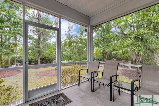 sunroom with wooden ceiling