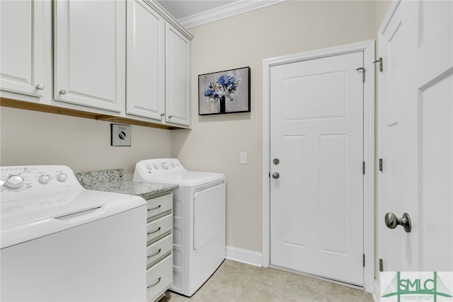 washroom featuring cabinets, washing machine and clothes dryer, light tile patterned floors, and crown molding