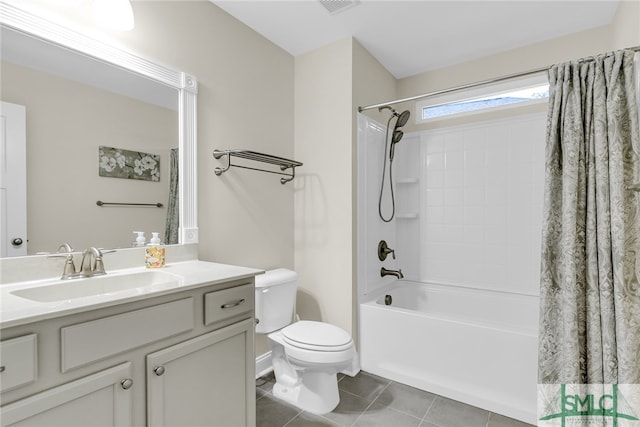 full bathroom with vanity, shower / bath combo with shower curtain, toilet, and tile patterned floors