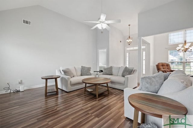 living room featuring ceiling fan with notable chandelier, high vaulted ceiling, and dark hardwood / wood-style flooring