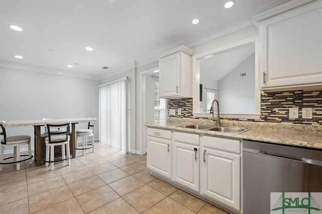 kitchen featuring light stone countertops, sink, white cabinetry, and stainless steel dishwasher