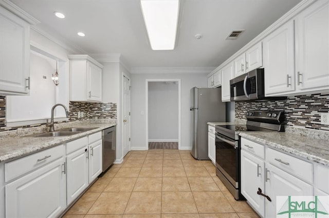 kitchen with ornamental molding, white cabinetry, sink, appliances with stainless steel finishes, and light tile patterned flooring