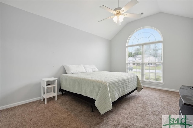 carpeted bedroom with vaulted ceiling and ceiling fan