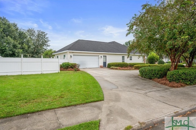 view of front of house featuring a garage and a front lawn