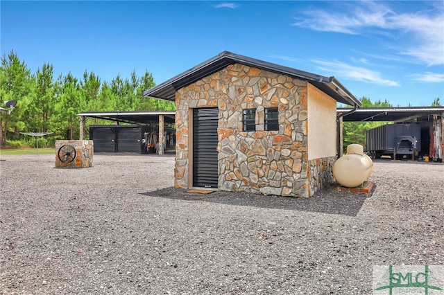 view of outbuilding featuring a carport