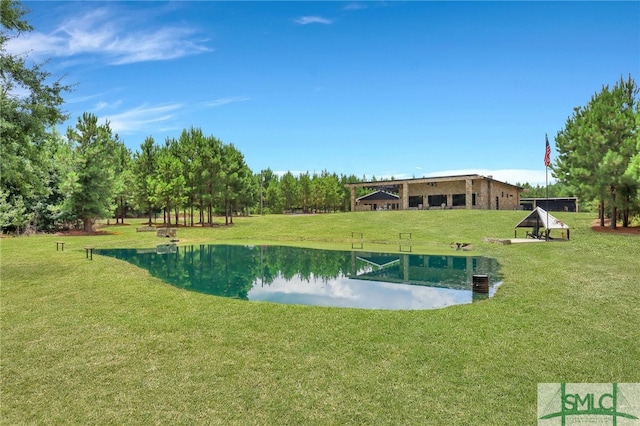 exterior space featuring a water view and a lawn