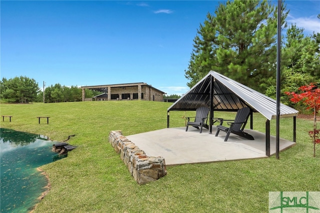 view of home's community with a yard and a patio