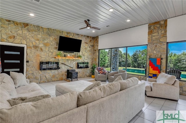 120 Saint Galilee Rd, Midville, GA 30441 - tiled living room with ceiling fan, a wood stove, recessed lighting, and wooden ceiling