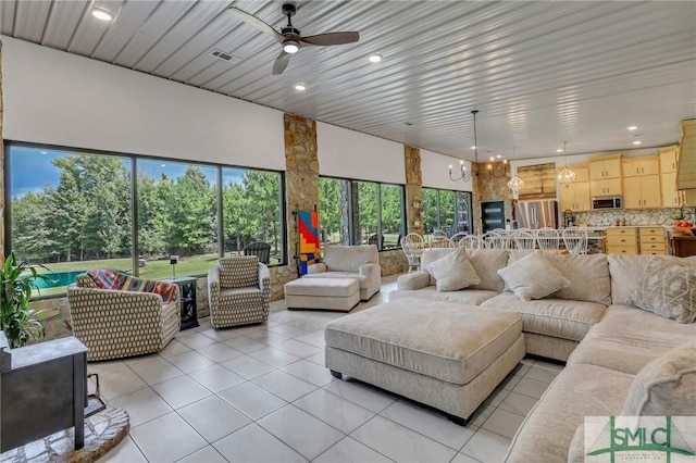120 Saint Galilee Rd, Midville, GA 30441 - living room featuring light tile patterned flooring, ceiling fan, recessed lighting, and a chandelier