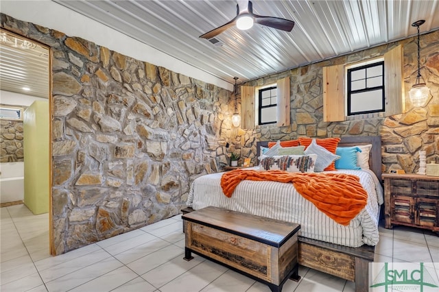 bedroom featuring wood ceiling, light tile patterned floors, and ceiling fan