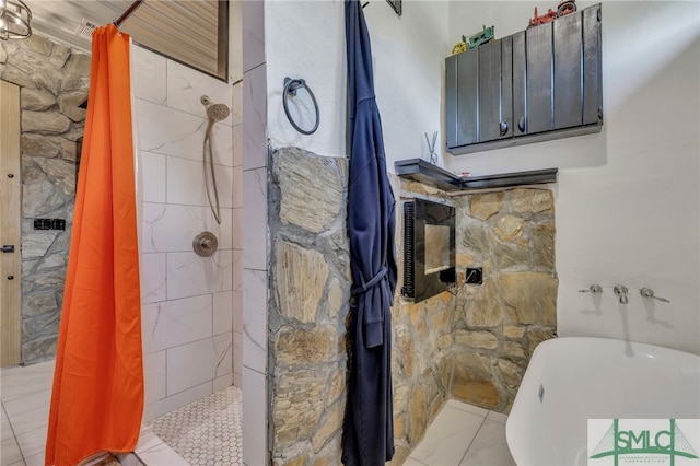 bathroom featuring walk in shower and tile patterned floors