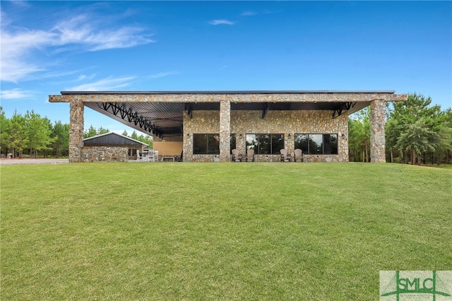 rear view of house with a lawn