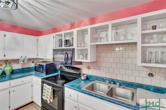 kitchen featuring black appliances, sink, backsplash, and white cabinets