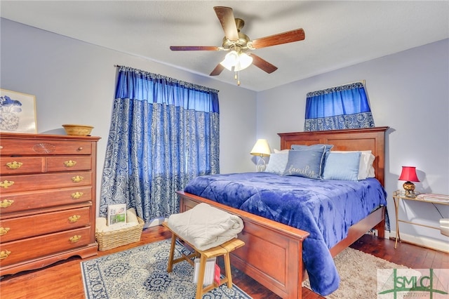 bedroom with hardwood / wood-style flooring and ceiling fan