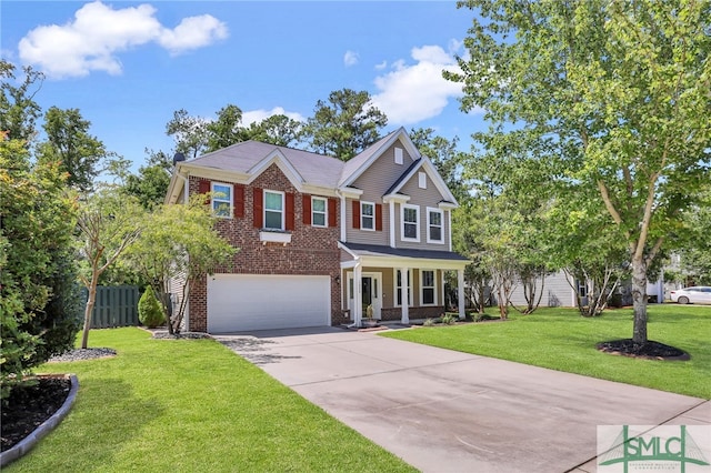 view of front of house featuring covered porch, a garage, and a front yard