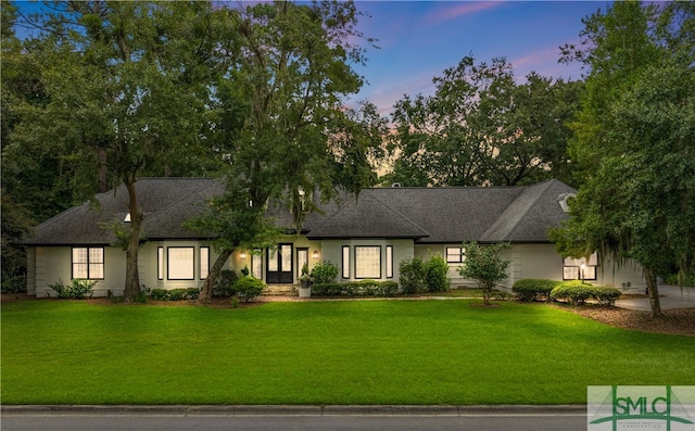 view of front of property with a lawn