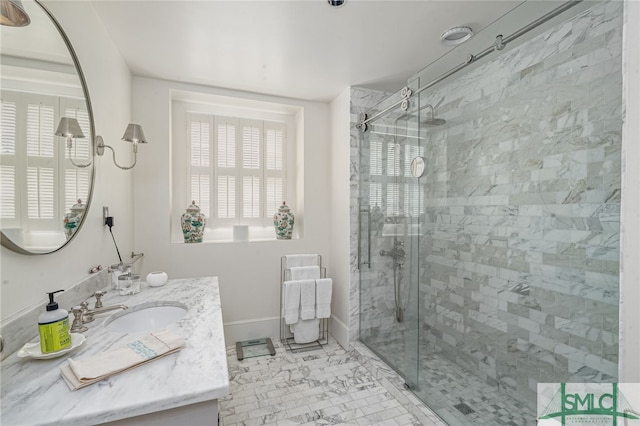 bathroom featuring vanity and a shower with shower door