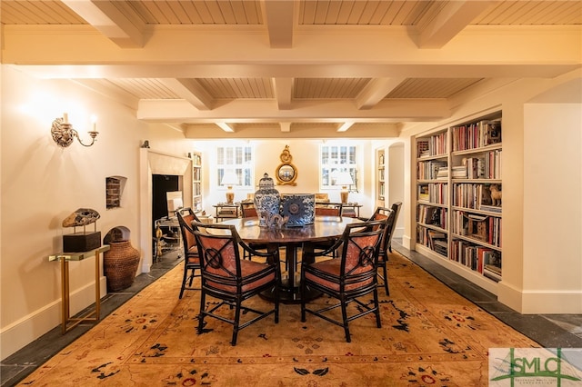 dining space featuring wooden ceiling, beamed ceiling, and ornamental molding