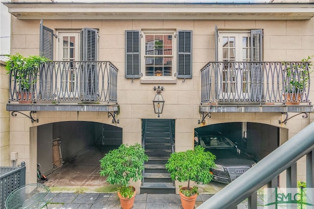 rear view of property featuring a balcony