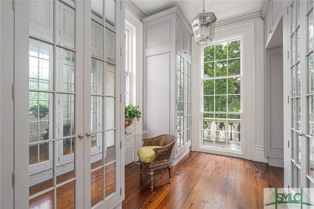 interior space with french doors and a notable chandelier