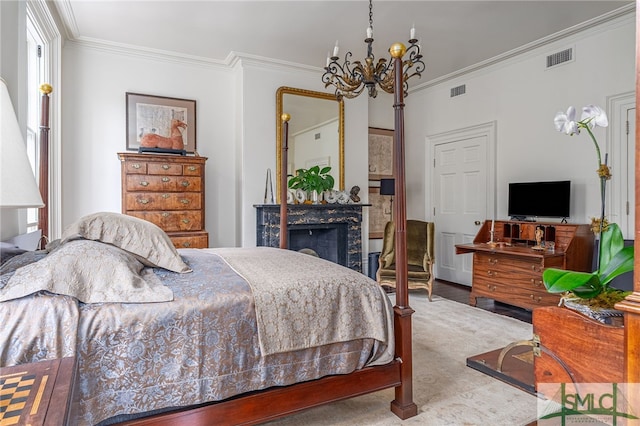 bedroom with ornamental molding, an inviting chandelier, and carpet floors