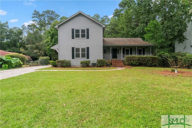 view of property with a front lawn and covered porch