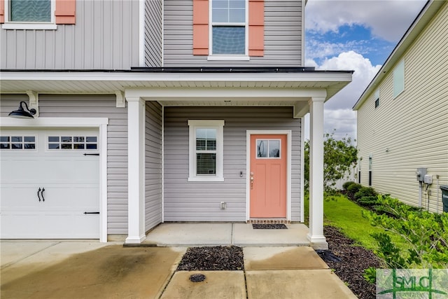 view of exterior entry featuring a garage