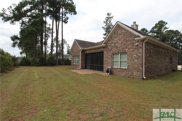 view of property exterior with a yard and a sunroom