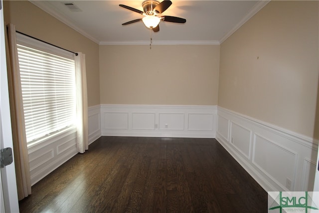 empty room with crown molding, ceiling fan, and dark hardwood / wood-style floors