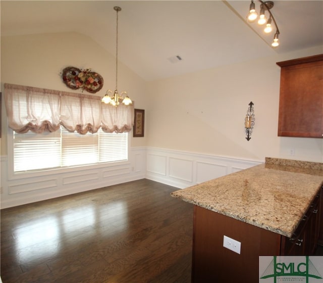 interior space featuring dark hardwood / wood-style floors, a chandelier, and vaulted ceiling