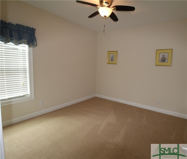 carpeted empty room with ceiling fan