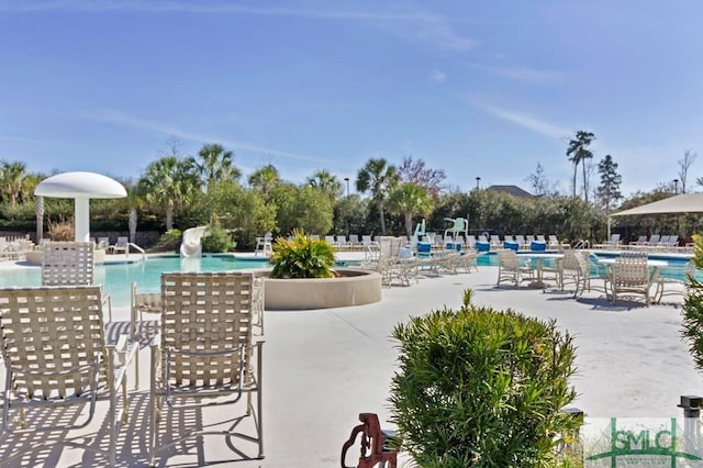 view of swimming pool with a patio area and pool water feature