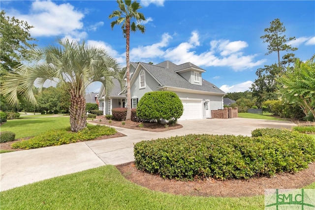 view of front facade with a front lawn and a garage