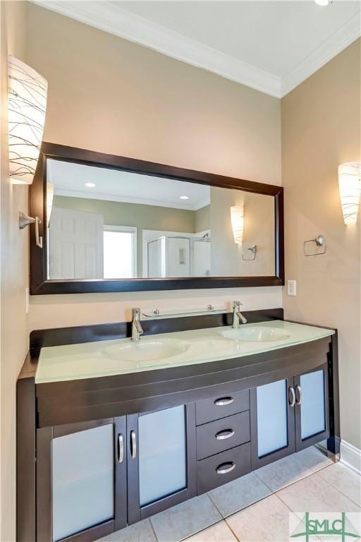 bathroom with tile patterned flooring, vanity, and ornamental molding