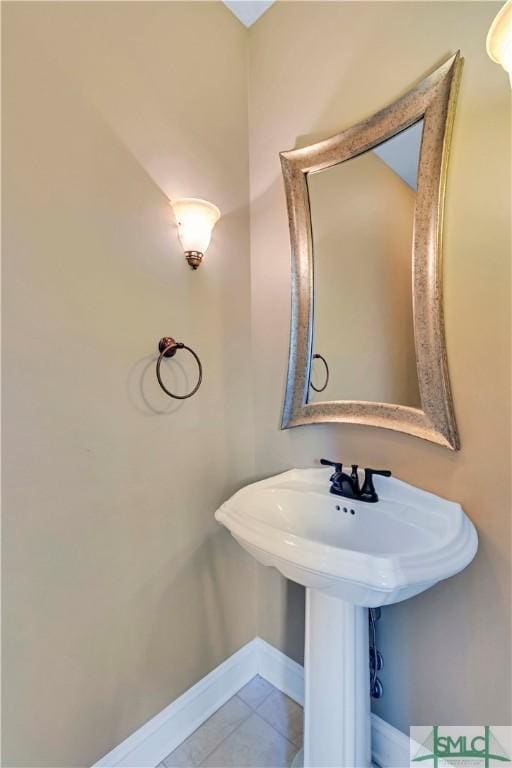 bathroom with tile patterned floors