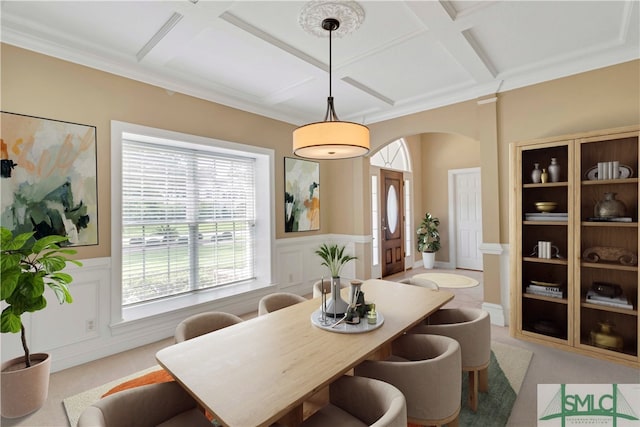 dining room with beamed ceiling, crown molding, and coffered ceiling