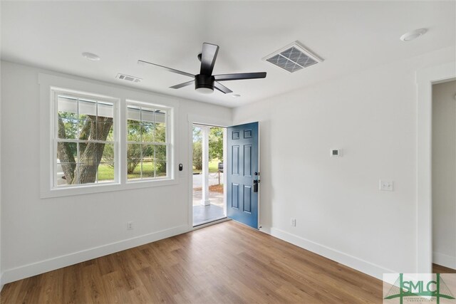 empty room featuring ceiling fan and hardwood / wood-style flooring