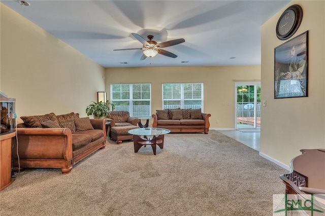 living room featuring ceiling fan and light carpet