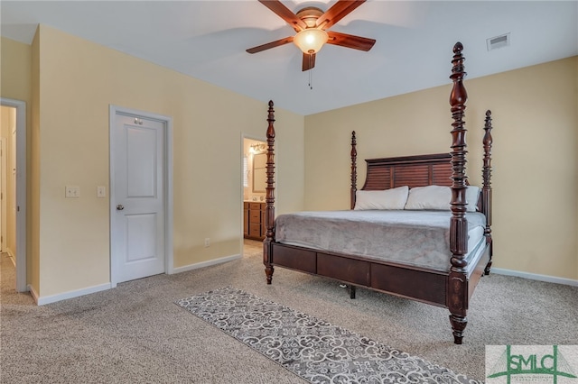 carpeted bedroom featuring ceiling fan and ensuite bathroom