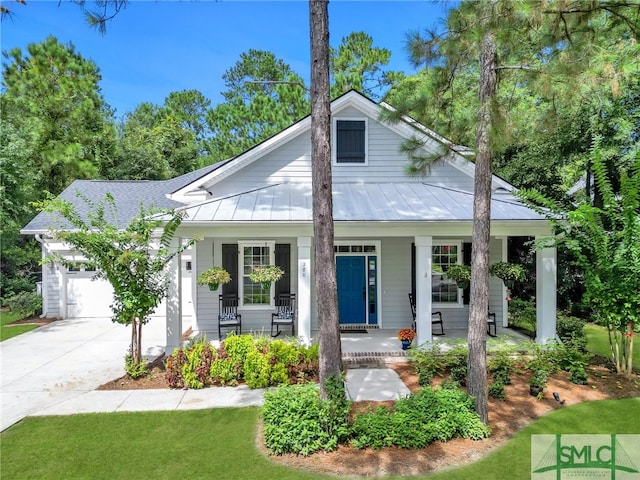 view of front facade with a porch and a garage