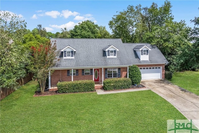 cape cod home with a garage and a front lawn