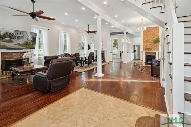 interior space featuring light hardwood / wood-style flooring, plenty of natural light, and a brick fireplace