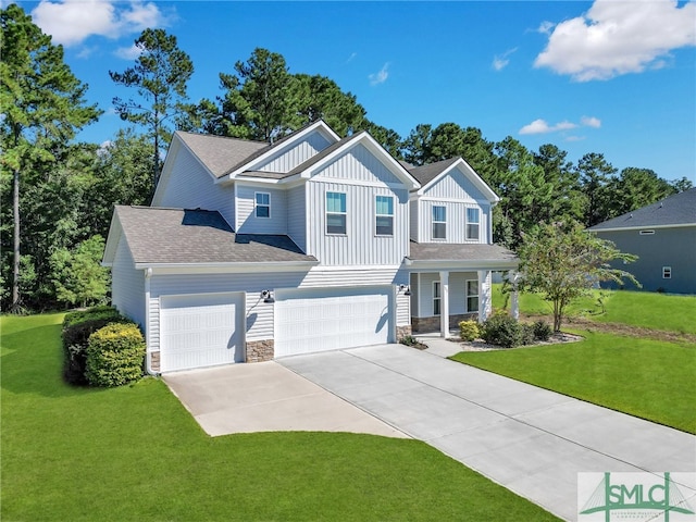 view of front of house with a garage and a front yard