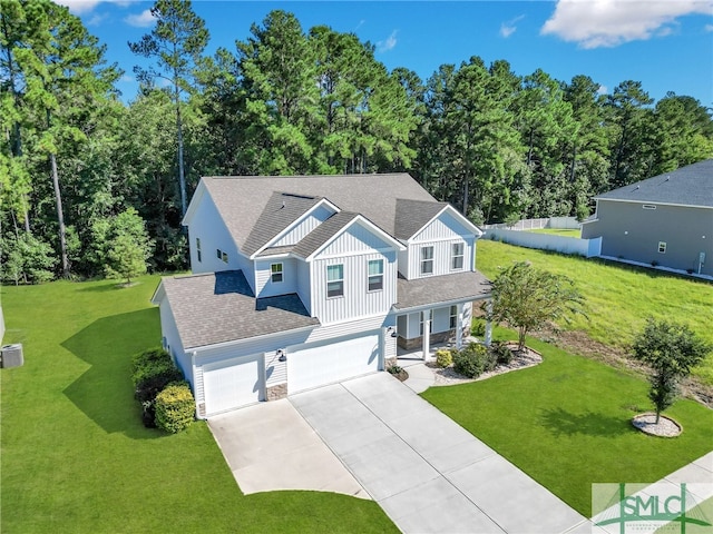 view of front of house with a garage and a front lawn